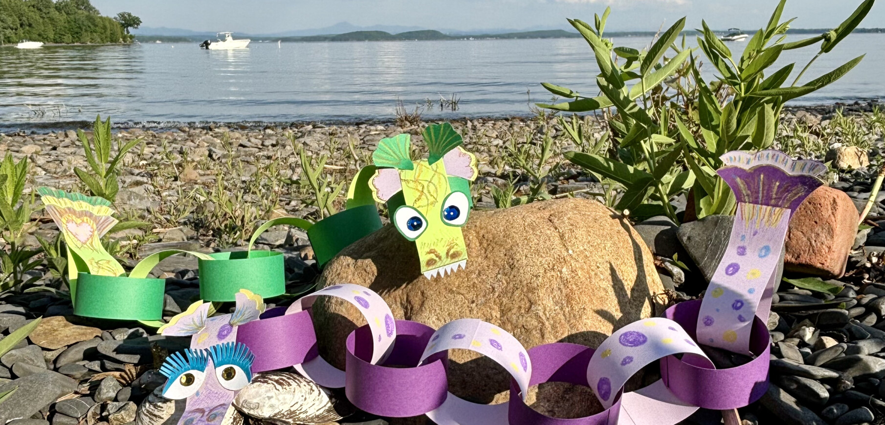 lake monster puppets hang out on the beach