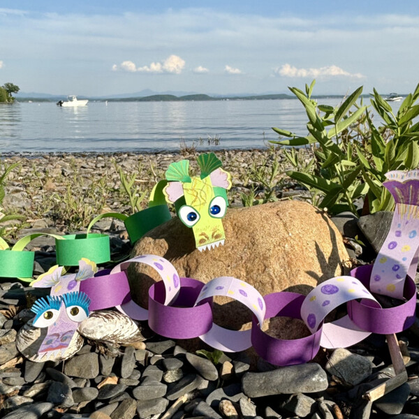 lake monster puppets hang out on the beach