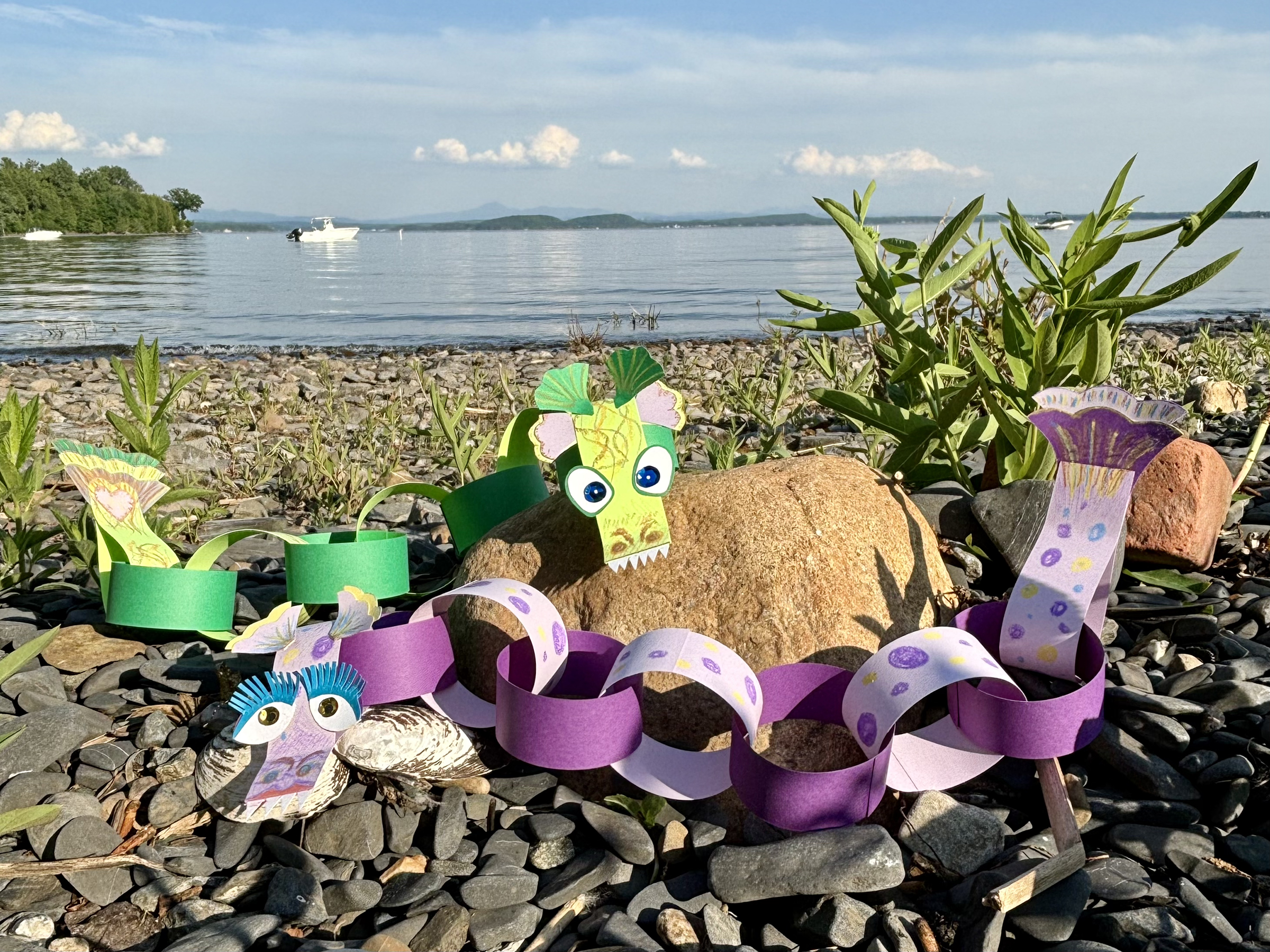 lake monster puppets hang out on the beach